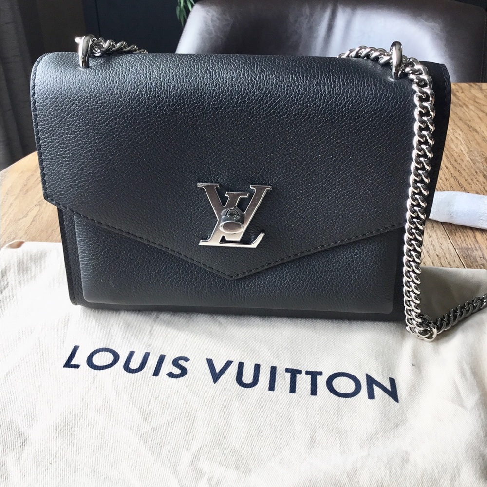 Authentic Louis Vuitton My Lock Me Purse Brand new never used. Dust cover.